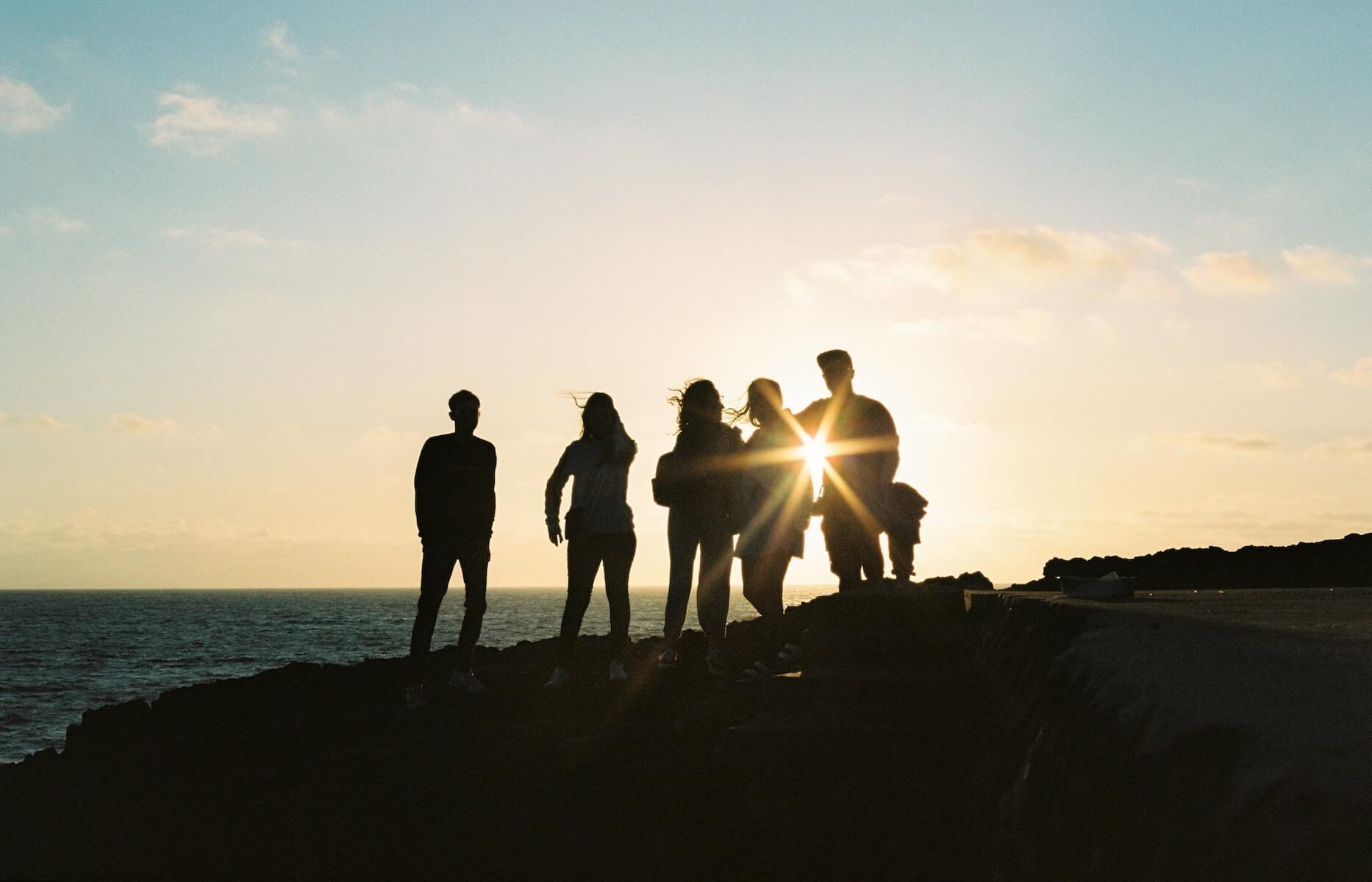people watching sunset