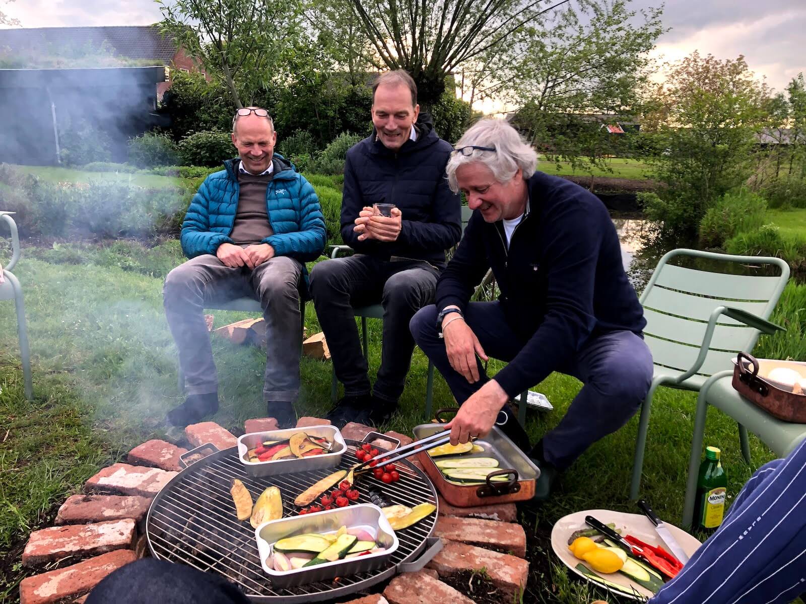 three men barbecue
